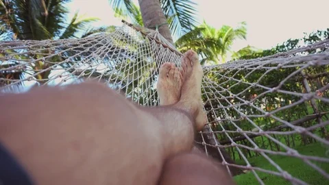 Man swing and relax in hammock Stock Footage 81134997