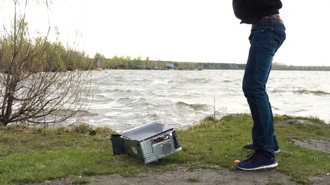 Man swings sledge hammer into printer, compuer and monitor on nature background 動画素材 92324970