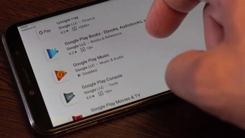 A man swipes a Google applications on his android smartphone. Stock Footage 134451368