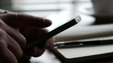 Man swiping through content on smartphone, 4K, UHD Stock Footage 48823618