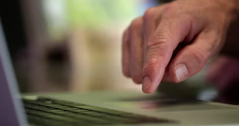 Man swipping through pictures on computer - close up on finger Video stock 148244189