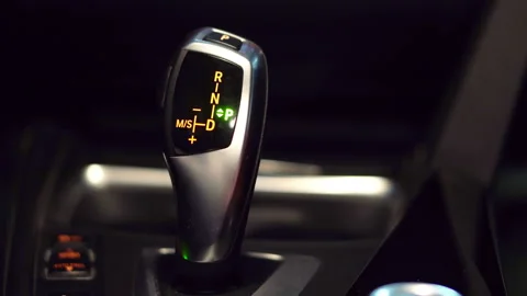 Man switches different modes on car gearbox Stock Footage 112627661