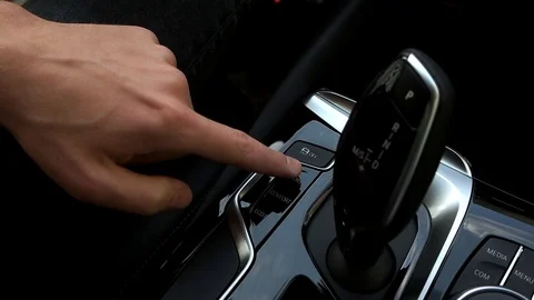 Man switches the driving mode in the car Stock Footage 89934728