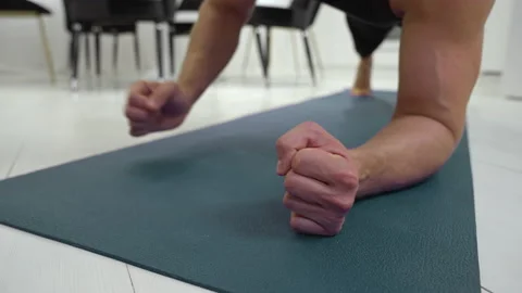 Man switches from forearms to palms during push-ups Stock Footage 237285006