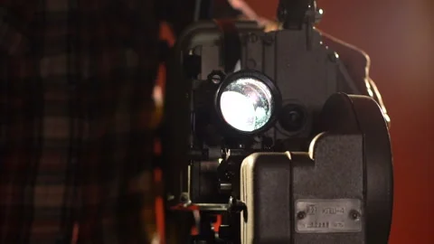 The man switches off the projector Stock Footage 86069671