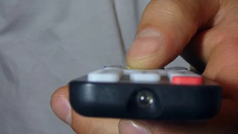 The man switches the TV remote Stock Footage 112152226