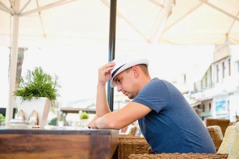 Man at a table in a cafe Stock Photos
