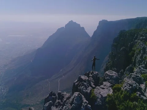 Man on Table Mountain with City in the Background Stock Footage 79732357