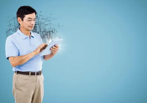 Man with tablet and flare against buildings sketch and blue background Stock Photos