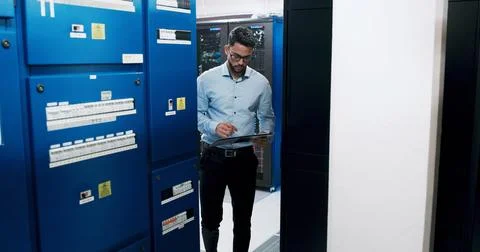 Man, tablet and programmer for inspection in server room, scroll and checklist Stock Photos