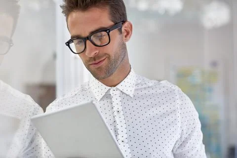 Man, tablet and reading in office for creative agency, schedule or review a.. Stock Photos