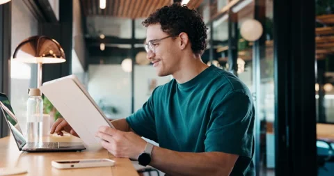 Man, tablet and remote work in restaurant with laptop, review or check software Stock Footage 335854124