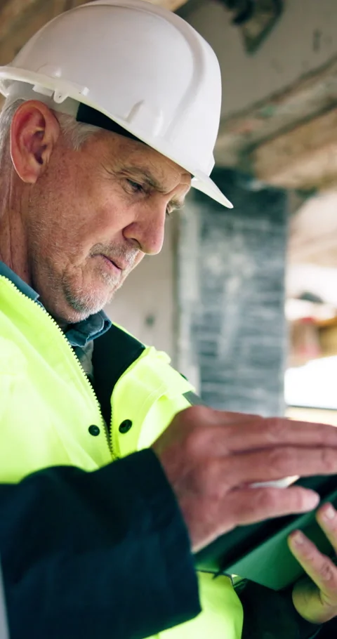 Man, tablet and scroll on construction site for inspection, task brief or safety Stock Footage 340874468
