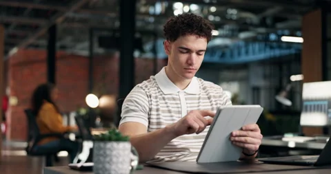 Man, tablet and scroll with thinking in office at night, ideas for marketing Stock Footage 340608835