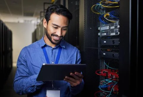 Man, tablet and server room, programming or coding for cybersecurity Stock-Fotos