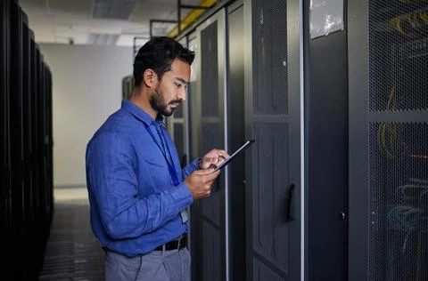 Man, tablet and technician in data center, research and programming. Information Stock Photos