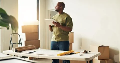 Man, tablet and thinking in new home for remodeling, interior planning and .. Stock Photos