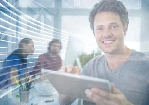 Man with tablet behind arrow graphic overlay Stock Photos