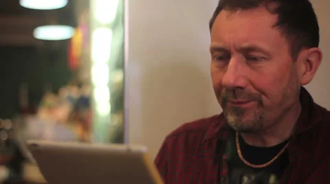 Man on tablet in cafe 2 Stock Footage 34344003