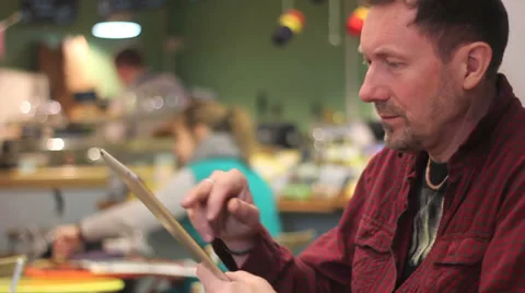 Man on tablet in cafe Stock Footage 34343970
