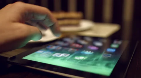 The man on tablet computer scans the browser Safari from Apple. Video stock 59960695