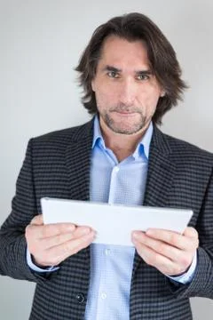 Man with the tablet in his hands Stock Photos