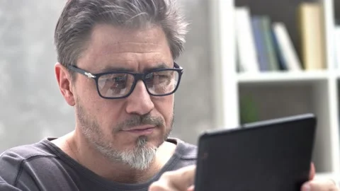 Man with tablet at home Video stock 149202012