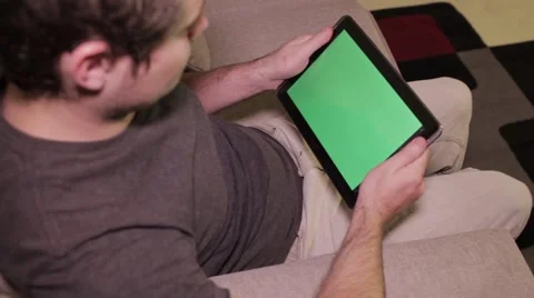 Man on Tablet - Landscape Green Screen Stock Footage 40256212