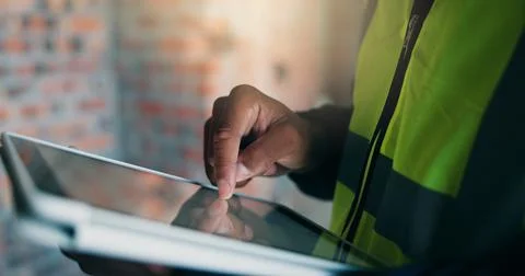 Man, tablet or hands at construction site for planning, building renovation.. Stock Photos