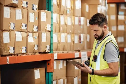 Man, tablet or logistics with checklist in warehouse for shipping, tracking.. Stock Photos