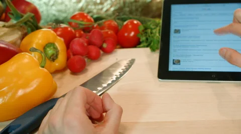 The man on the tablet PC searches for breakfast recipes. Stock Footage 62843352
