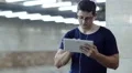 Man with tablet pc stands inside underground station HD Footage