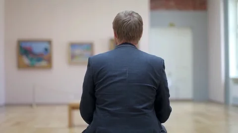 Man With a Tablet in the Picture Gallery Stock Footage 78919294