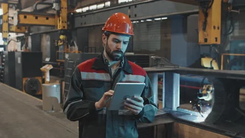 Man with Tablet Posing at Factory Stock Footage 197590435