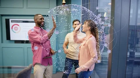 Man with tablet raising hand starting high-five, data sphere growing around trio Stock Footage 337912968