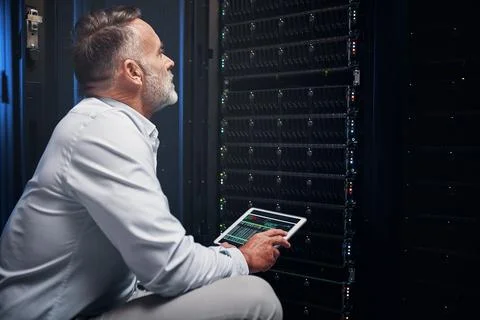 Man, tablet screen and rack inspection in server room for CPU usage, access.. Stock Photos