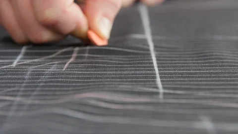 Man Tailor Making Sewing Patterns On Table. Close Up Of Hands Tracing Lines on Video stock 127219224