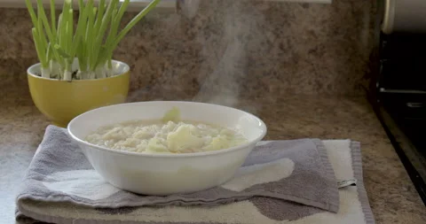 A man take the bowl of noodle from the kitchen counter Stock Footage 131926484
