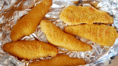 Man take chicken strips. Time lapse. Stock Footage 70402660