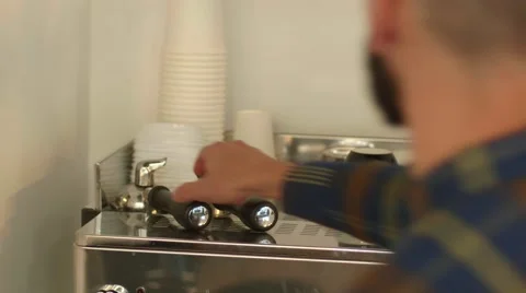 Man take the horn from the coffee machine/ 4k UHD Video stock 58491970