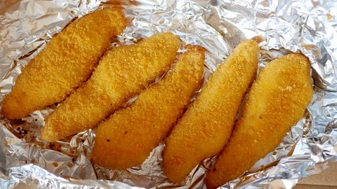 Man take one chicken strip. Stock Footage 70402465