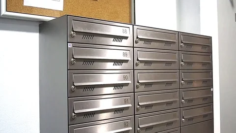 Man take post from letter box Stock Footage 84774982