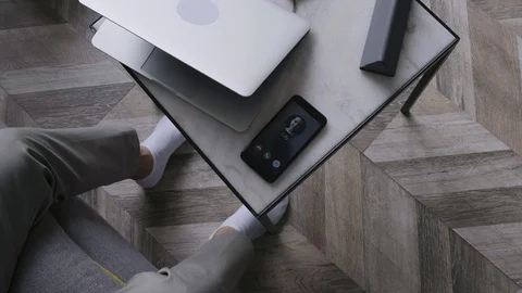 Man Take Ringing Phone From Table Stock-Footage 114823298