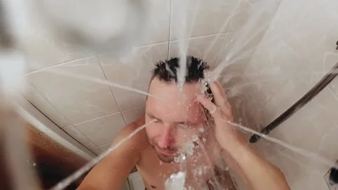 Man take a shower in bathroom. Stock Footage 135462552