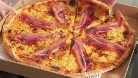 Man take a slice of hot pizza with ham cheese close up macro shot. Pizza and Video stock 336586673