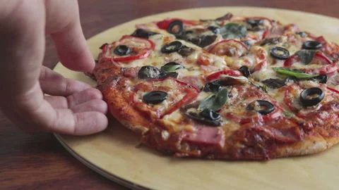 Man take a slice of pizza with melting cheese Stock Footage 102643815