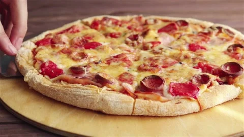 Man take slice of pizza with stretching cheese tomatoes sausages close up Stock Footage 115083218