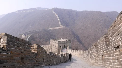 Man take stairs on Great Wall of China Stock Footage 99552517