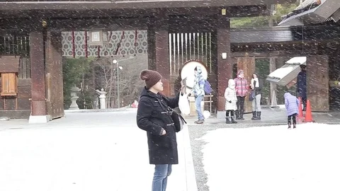 Man take video using smart phone during winter Stock Footage 85087359