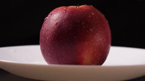 Man takes an apple with his hands. Stock Footage 186988735